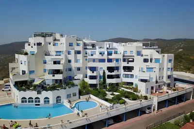 Image de Appartement 'Perlazul' avec vues panoramiques, piscine extérieure et intérieure chauffée