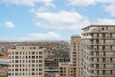 Image de Balcony Views: City & Sea in a Modern Apartment