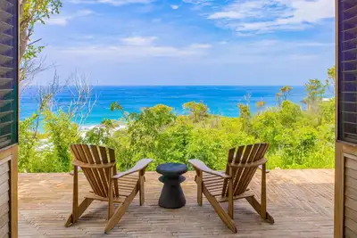Image de Spacious beachside home with pool, tropical garden, and oceanview lounging