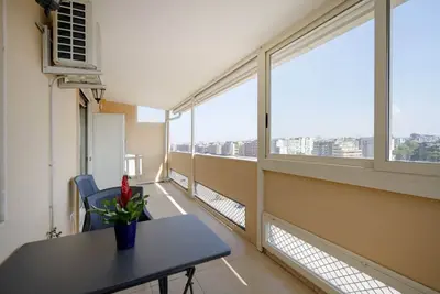 Image de Cozy 95 sqm apartment with terrace, able to accommodate up to 6 people, located on the ninth floor of a building with lift (5 steps to access). The accommodation offers a view of the city of Bari from above and is located in a very convenient position, i