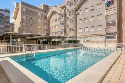 Image de Appartement 'En Playa De Daimús' avec Piscine Commune, Wi-Fi et Climatisation