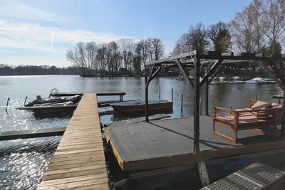 Image de Tiny house with outdoor chimney and an own water jetty at the lakeside.