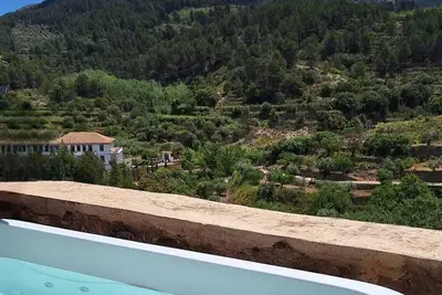 Image de \"Balcón de Aitana\" : rural house with large terrace, jacuzzi and mountain views.