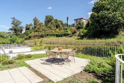 Sunlit Retreat with Green Terrace by HostWise