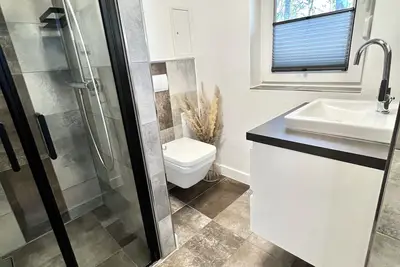 Image de Modern vacation home \"Anker 1\" with fireplace, underfloor heating & garden with dog