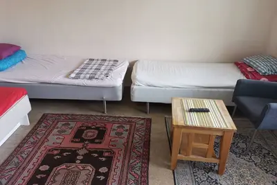 Image de One large room with 3 single beds. Max for three people 12 min from city center