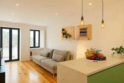 Image de Apartment in the former working-class neighborhood linked to the wool industry. The bright living room and decor featuring burel pieces evoke the city's history. A fully equipped kitchen, two comfortable bedrooms, and  ensure an autentic stay.