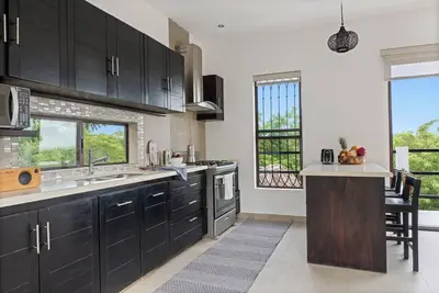 Image de 3 story home with exceptional views of the breaking surf and expansive mangroves