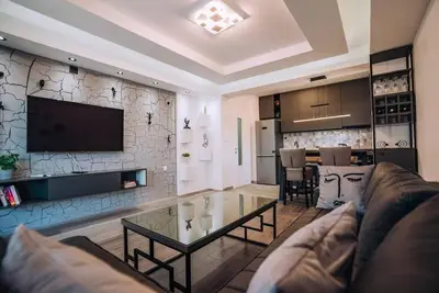 Image de Grey Corner Apartment - Where Comfort Meets Modern Elegance