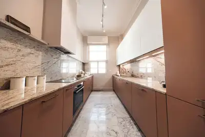 Image de A sophisticated coastal retreat blending history, design, and light. Balluta 14b Suite captures the spirit of Balluta Bay through serene tones, curated textures, and modern elegance within a grand heritage building.