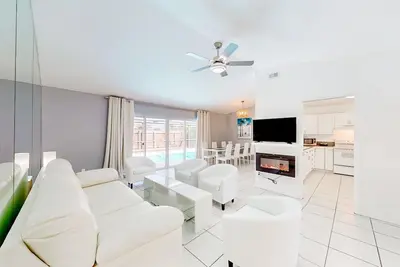 Image de Coastal home with pool, lanai, patio, & fireplace