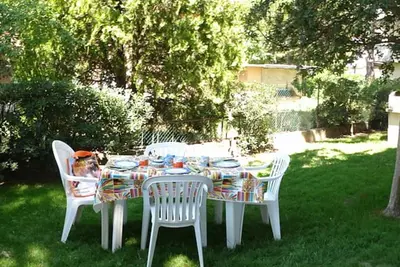 Image de Maison Bibione avec jardin et cheminée