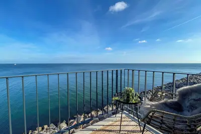 Image de Molenliebe - front row on the water, sea view, 3 balconies, sauna, e-charging column