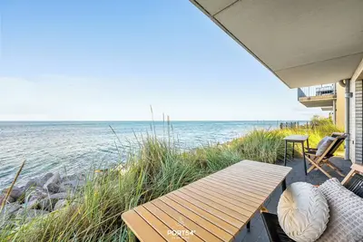 Image de Nordglanz - 1st row on the water, sea view, terrace, finn. Sauna, e-charging station