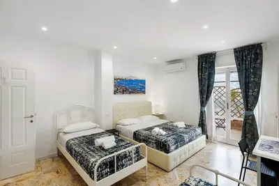 Image de Chambre 'Di Palma Suite Familiale' avec terrasse partagée, Wi-Fi et climatisation
