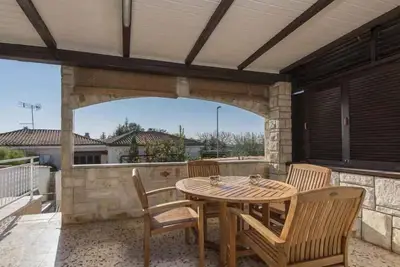 Image de Appartement de vacances avec terrasse couverte avec vue sur la mer