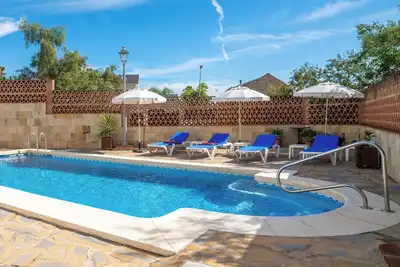 Bright apartment in a villa with heated swimming pool