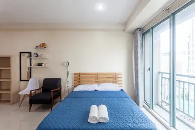 Image de Comfy condo. Best location on Shaw Blvd, front of Shang Mall. Short walk to Sm.