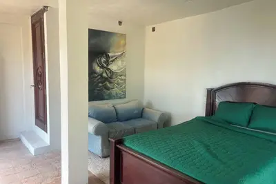 Image de The \"Chiclayo Suit\" has a terrace that ends in the beach, and facing the pool.