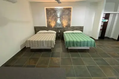 Image de Costa Ayala suite 1 with 2 dbl bed and 2 sofas, all basics, 2 blocks from beach