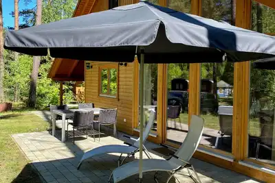 Image de Modern wooden house in Nordic style directly in the pine forest