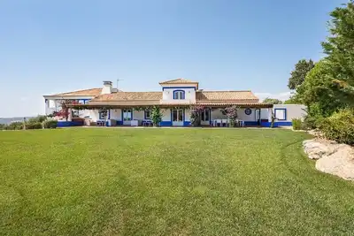 Image de A happy family home boasting lovely gardens and 2 swimming pools