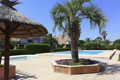 Image de L’Oasis – T2 avec jardin *piscine *Clim *Plage à 200m *Parking