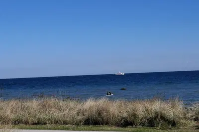 Image de Top penthouse apartment above the rooftops with partial sea views