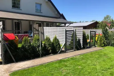 Image de Villa Kacper mit privatem Garten, Terrasse und Grill by Interhome