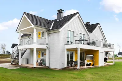 Image de Vacation apartment \"Dünengras\" in the Baltic Sea resort of Olpenitz - Modern accommodation with a street