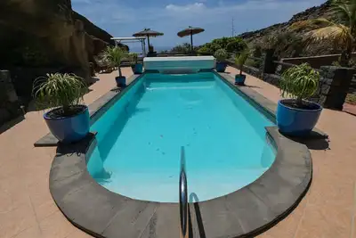 Image de Finca \"Castillo Bentley\" Schlafen in einer vulkanischen Höhle by Interhome