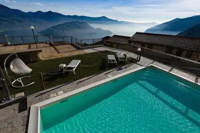 Image de Terrazza a Lago - Dreizimmerwohnung mit Terrasse und Schwimmbad by Interhome