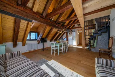 Image de A comfortable 102 square meters apartment, perfect for seven people, located on the second floor of a historic building dating back to 1864 and renovated in 2025 while maintaining its historic atmosphere (No elevator). The property is located on Tarvisio'