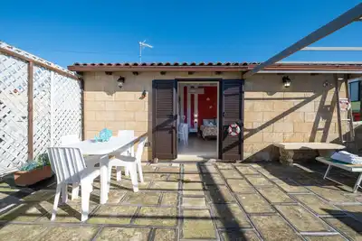 Image de Boutique Villa – Loft Aura avec terrasse commune, Wi-Fi et climatisation à Porto Cesareo