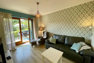 Image de Lüttes Glück à Lemkenhafen – Appartement lumineux avec terrasse et vue sur la nature