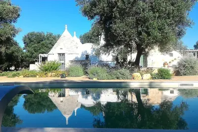 Image de Maison de vacances « Trullo I Luoghi Del Sole 2018 Sun's » avec balcon, Wi-Fi et climatisation