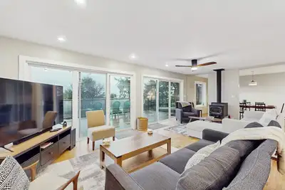 Image de Modern ocean view home with private hot tub, big deck, and family-ready spaces