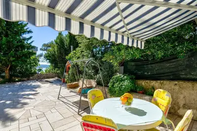 Image de Appartement romantique à seulement 200 mètres de la plage avec barbecue, climatisation, WiFi