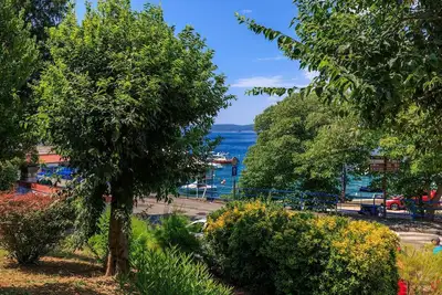 Image de Appartement fascinant à seulement 50 mètres de la plage avec vue sur la mer, lave-linge, climatisation, WiFi