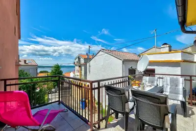 Image de Appartement confortable à seulement 300 mètres de la plage avec vue sur la mer, chaise longue, barbecue