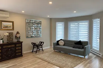 Image de Bright, Renovated & Fully Furnished Condo – Garage + Terrace – 10 min to Metro