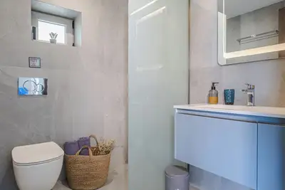 Image de Anatoli (Sunrise), an exquisite seaside villa, with the vibrant hues of sunrise.