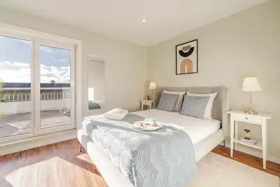 Bright Beachside Flat with Terrace by HostWise