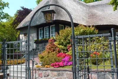 Image de Rügen vacation near the beach - Landhaus Wilkens vacation apartment Reetblick - Landhaus