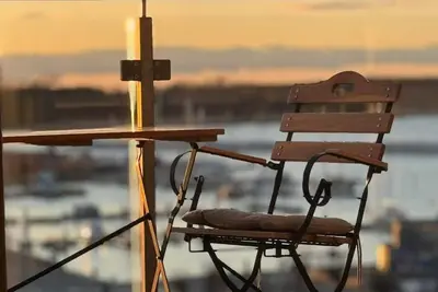 Image de Penthouse en bord de mer à Barth – Vue sur l’eau, terrasse sur le toit et détente