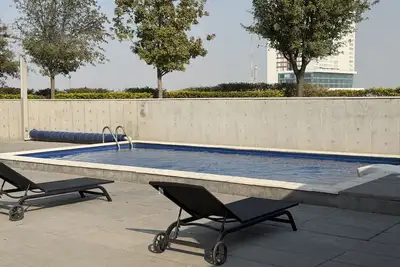 Image de Dpto cerca del centro | Alberca, gym y asadores