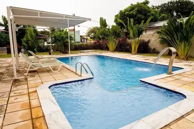 Image de Casa com piscina, churrasq, Wi Fi próximo ao mar