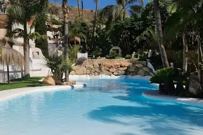 Image de Appartement 'Oasis Tropical' avec parking, piscine et climatisation