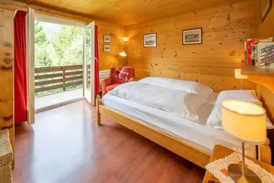 Charming Swiss chalet with stunning mountain views.