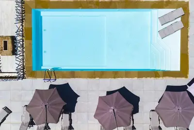 Image de Wohnung GIallo mit Schwimmbad und Meerblick by Interhome